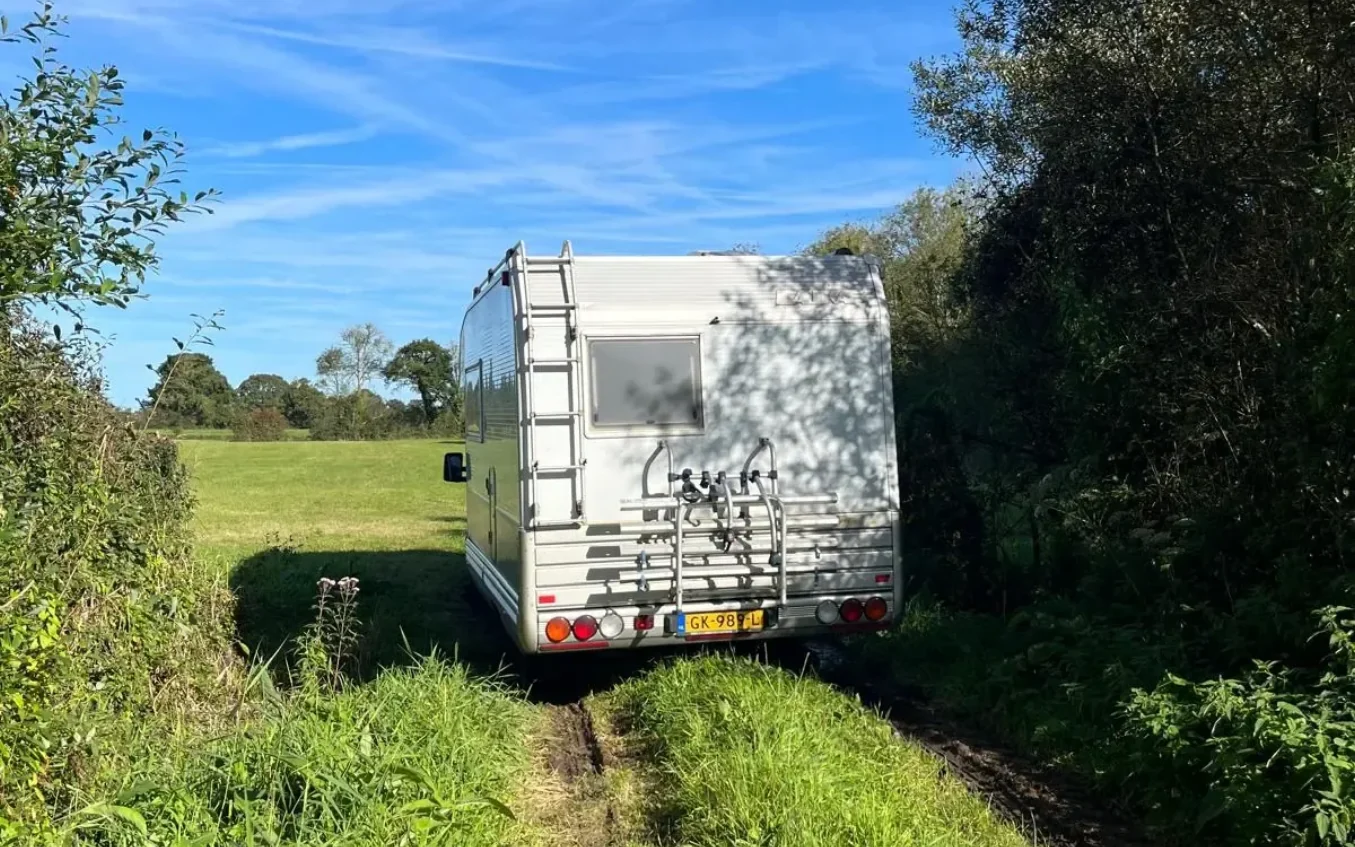 Camper vehicle on a narrow country road